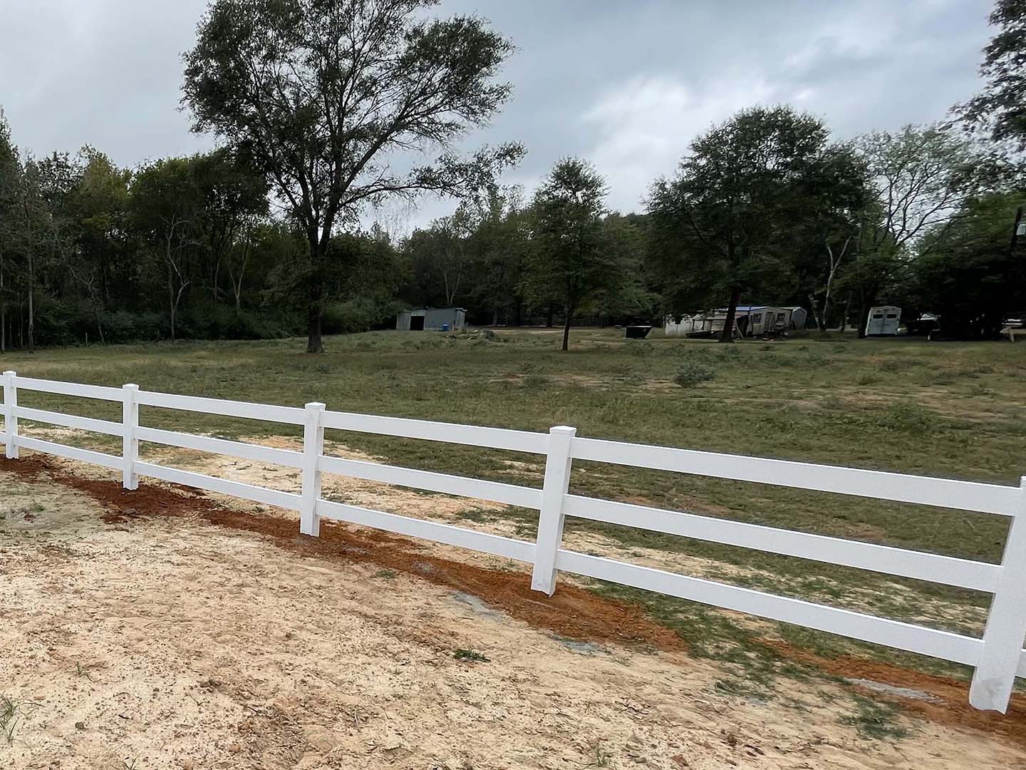 White vinyl farm fence install in Lufkin Texas